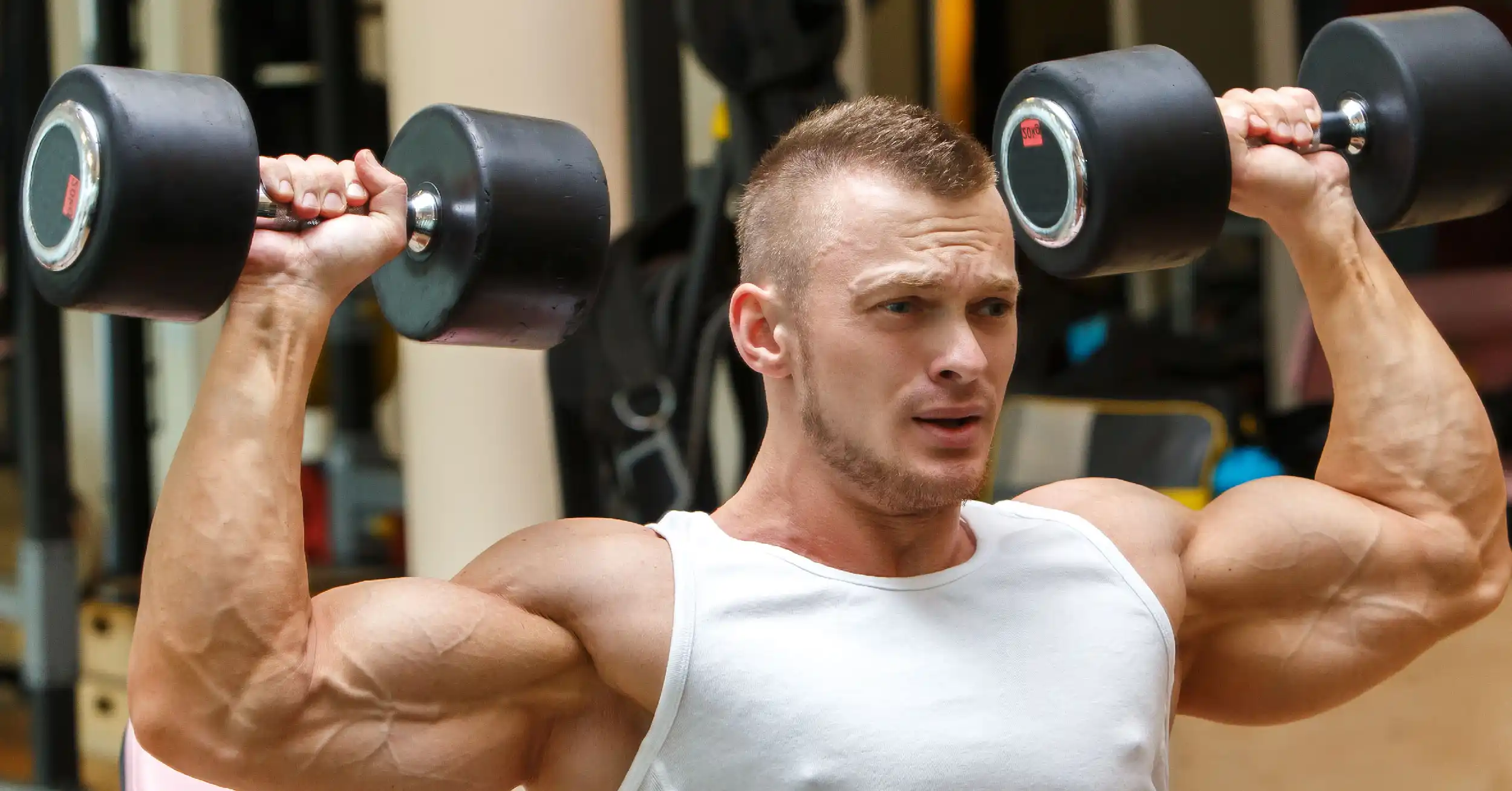 man with light weight dumbbells